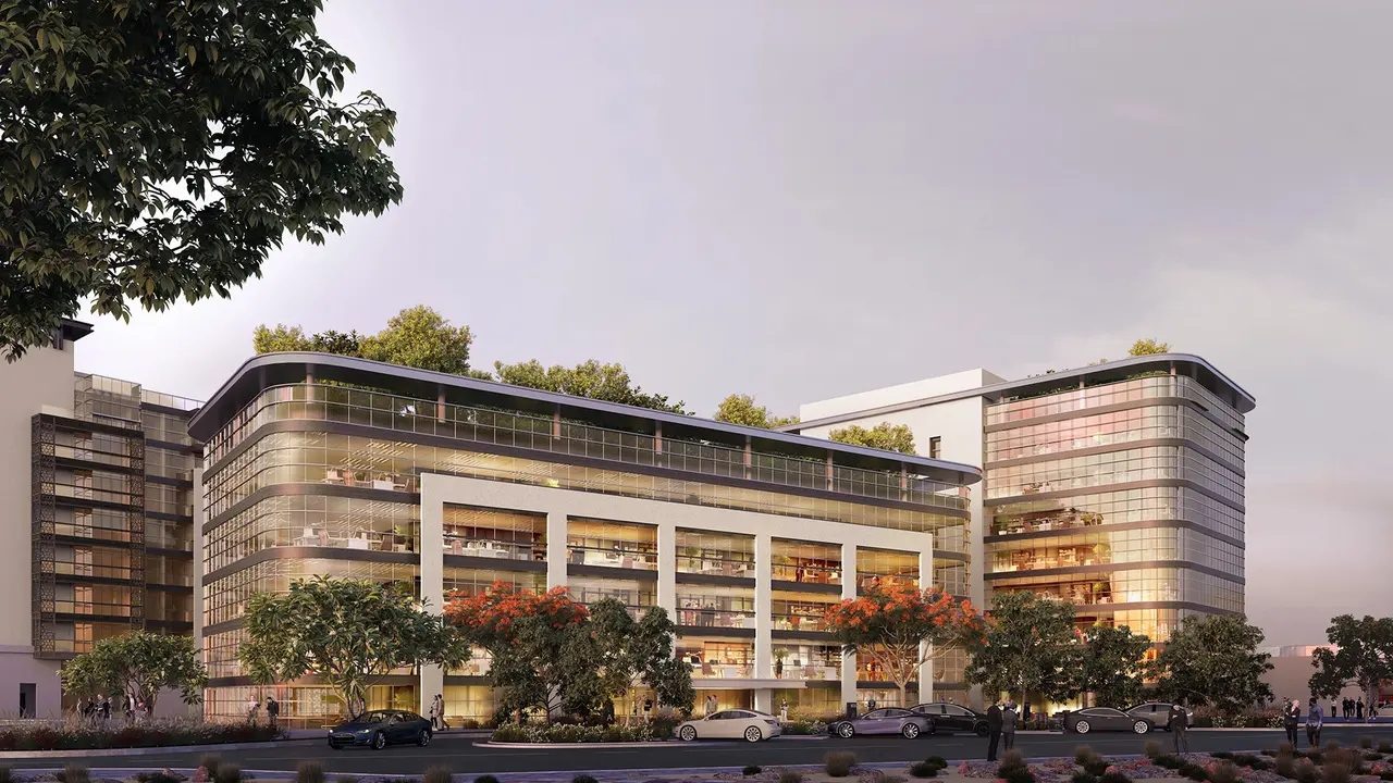 Mixed-use waterfront building with terraces and greenery
